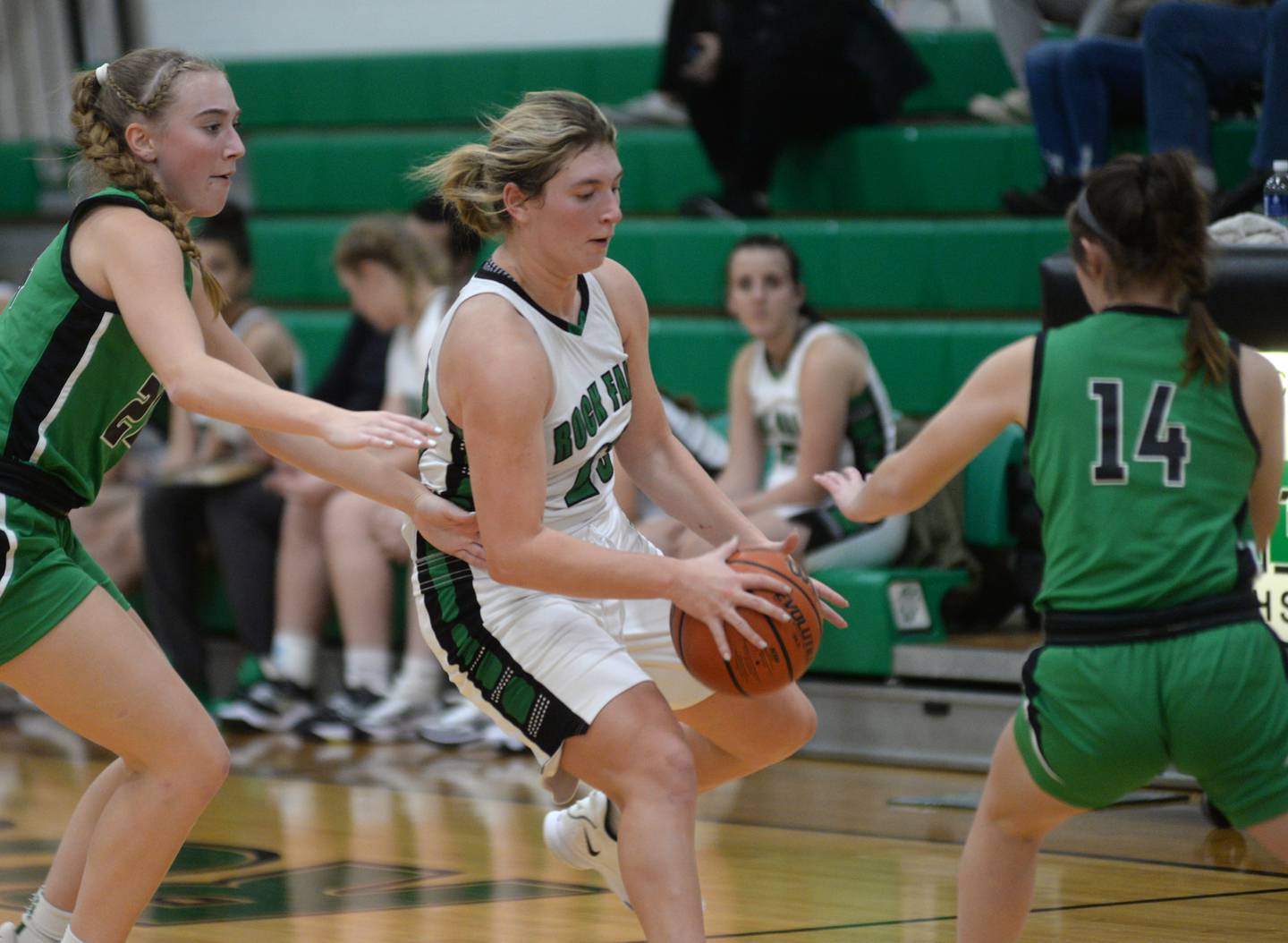 Rock Falls' Claire Bickett (23) tries to control the ball as she dribbles between two Alleman defenders during a Monday, Nov. 27, 2023 at Rock Falls High School.