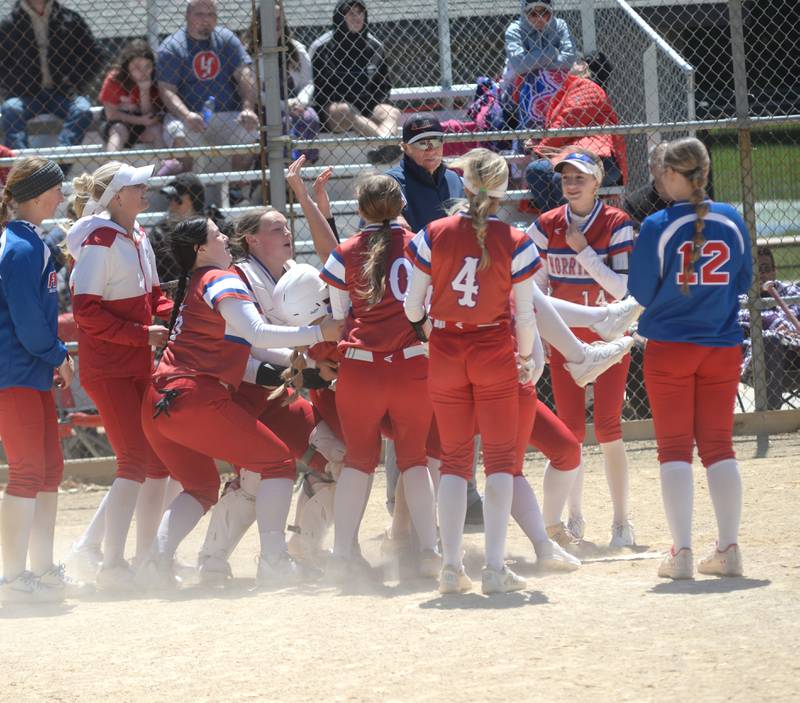 Morrison's Bella Duncan falls back into her teammates before being tossed into the air after hitting a home run in the Fillies 5-0 win over Oregon  on Saturday, May 17, 2025 at Oregon Park West.