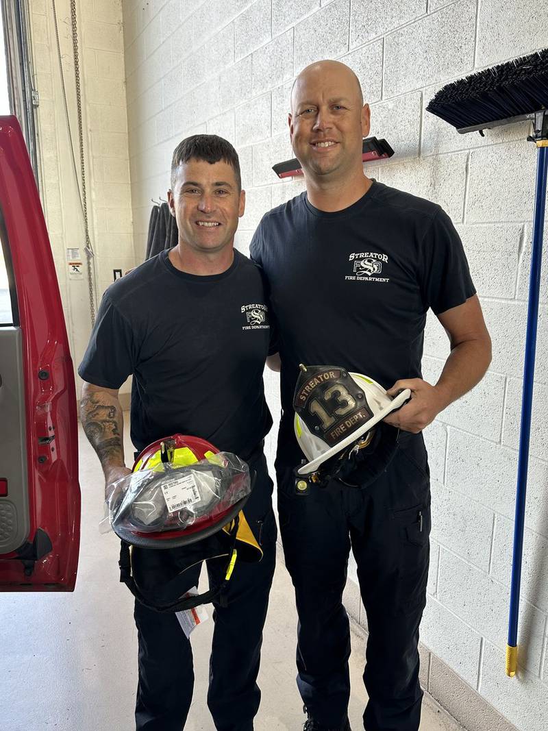 Ed Levy and Brian Parks pose for a photo at Streator Fire Department after being recently promoted.