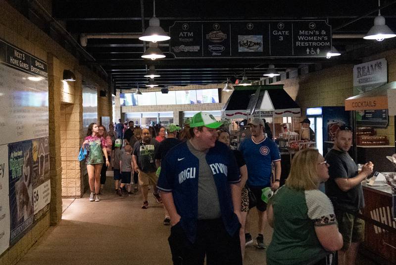 Sean King for the Daily Herald
Kane County Cougars fans walk along the vendor concourse during opening day at Northwestern Medicine Field in Geneva on Friday, May 13, 2022.