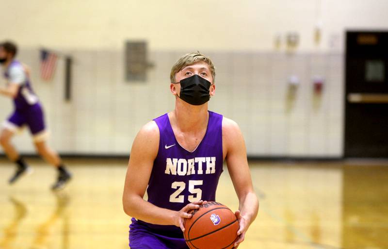 Kyle Engstler shoots the ball during the first official contact day for boys basketball at Downers Grove North High School on Tuesday, Jan. 26, 2021.