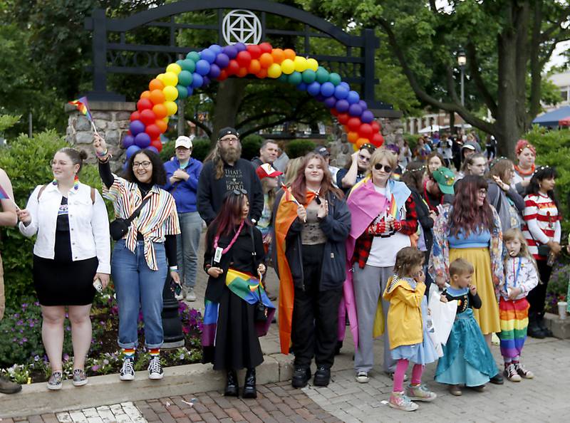 People watch the Woodstock PrideFest Parade Sunday, June 11, 2023, around the historic Woodstock Square.