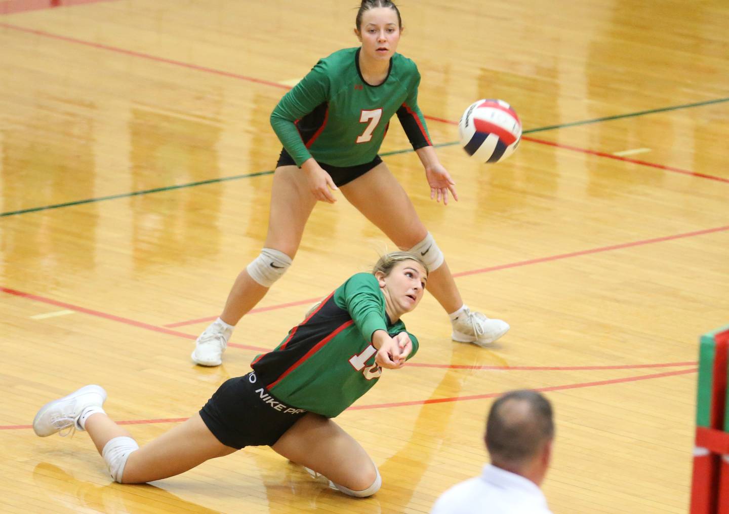 L-P's Kelsey Frederick digs the ball off of the floor as teammate Ruby Davis backs her up on Tuesday, Oct. 15, 2024 in AJ Sellett Gymnasium at L-P High School.