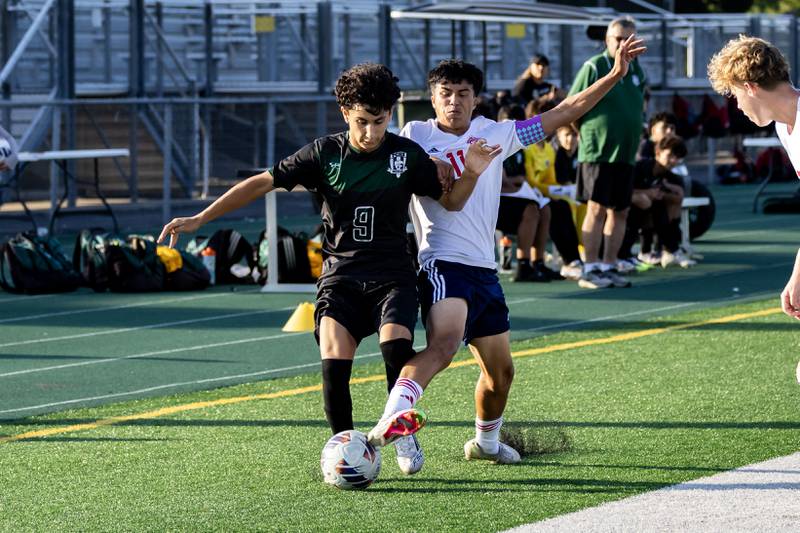 Plainfield Central’s Diego Gonzalez and South Elgin's Alan Munoz fight for control of the ball during a game at Plainfield Central on Aug. 28, 2025.