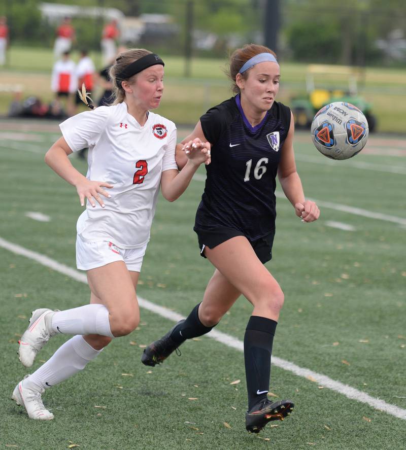 Glenbard East's Sarah Liljestrand competes for the ball against Downers Grove North's Caroline Siebert  during the regional final game Friday May 20, 2022.