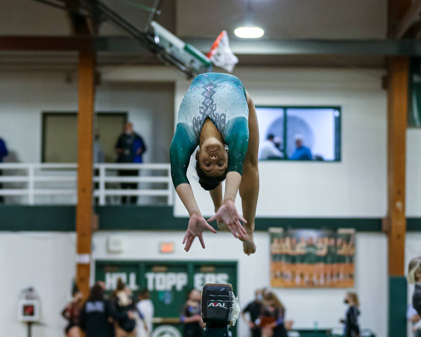 Glenbard West's Alina Bhagwakar performs on the balance beam during the Glenbard West Sectional. Feb 10, 2022.