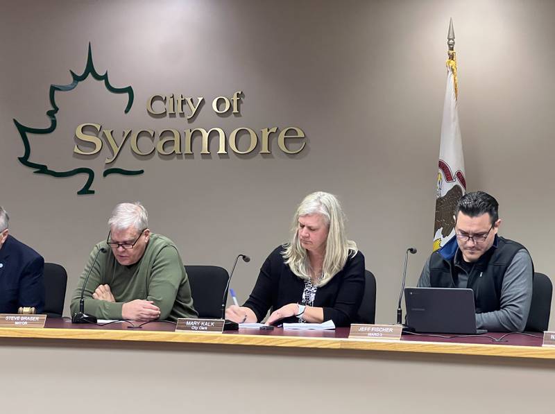 Sycamore Mayor Steve Braser, sitting next to Sycamore City Clerk Mary Kalk and 3rd Ward Alderman Jeff Fischer, talks during the March 4, 2024, Sycamore City Council meeting. During that meeting, officials discussed the notion of removing the city clerk position from future ballots, and filling the job through appointment.