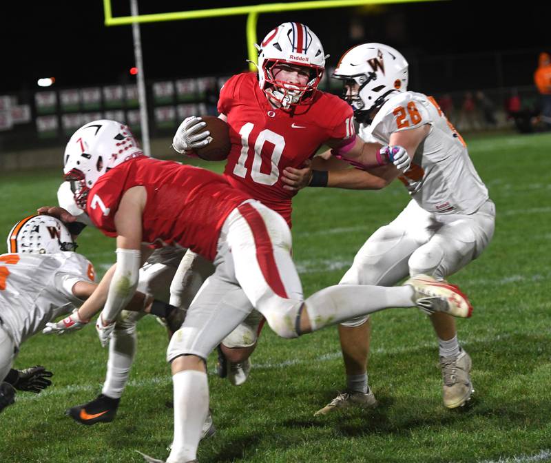 Oregon's Keaton Salsbury (10) fights for yards against Winnebago on Friday, Oct. 17, 2025 at Landers-Loomis Field in Oregon.