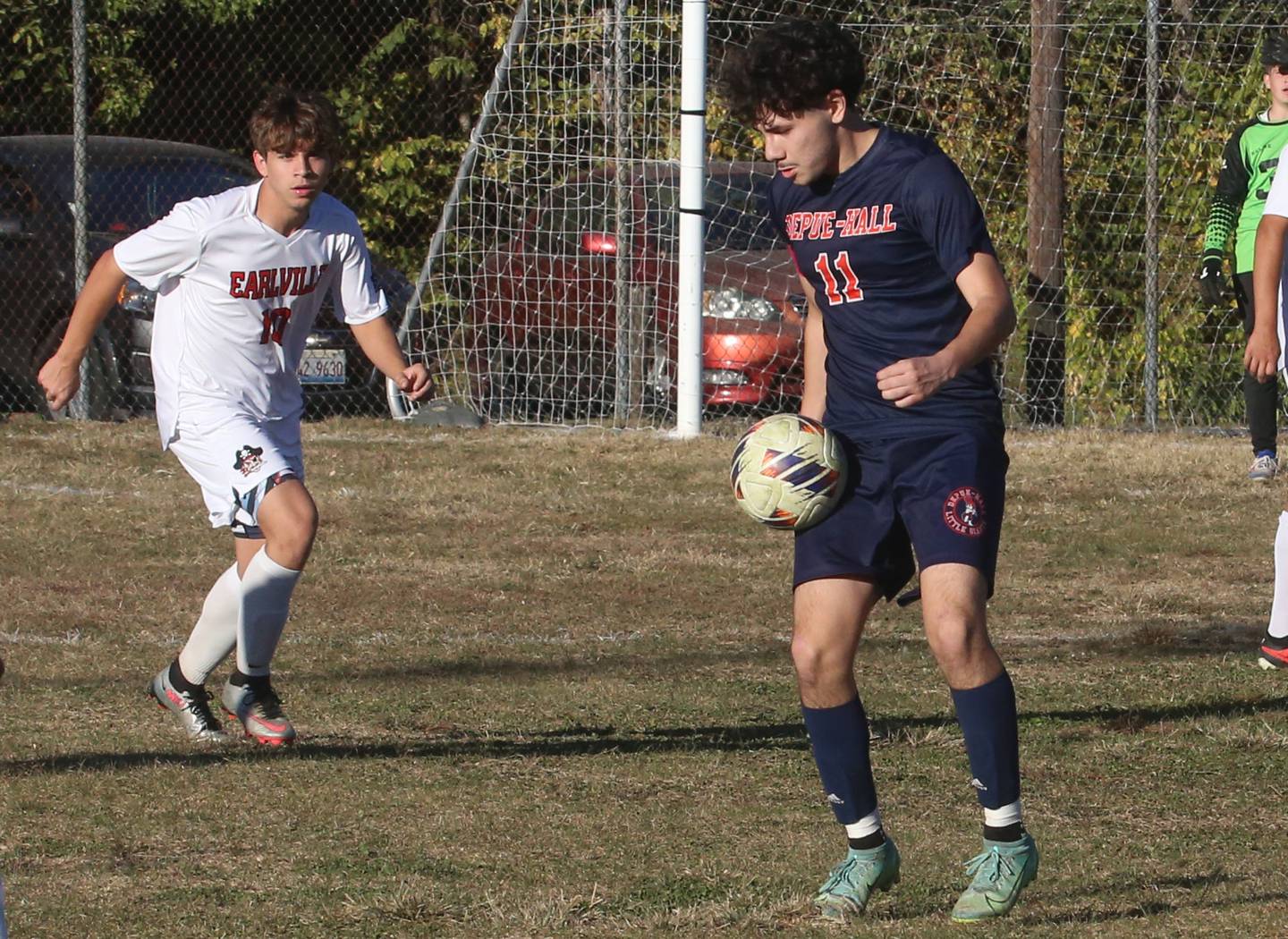 DePue/Hall's Grabiel Cano knocks the ball down in front of Earlville's Adin Hensley during the Class 1A Regional quarterfinal game on Wednesday, Oct. 16, 2024 in DePue.
