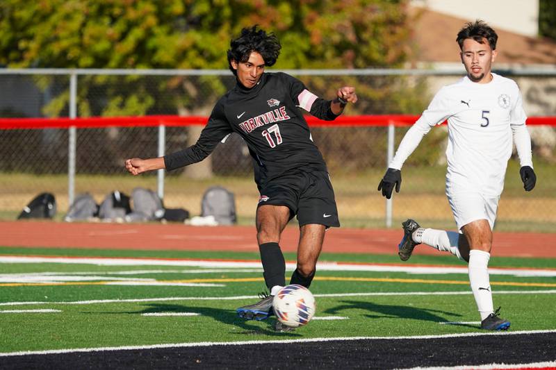 Yorkville's Joseph Kallan (17) shoots the ball for a goal against Oswego East during a soccer match at Yorkville High School on Tuesday, Oct. 15, 2024.