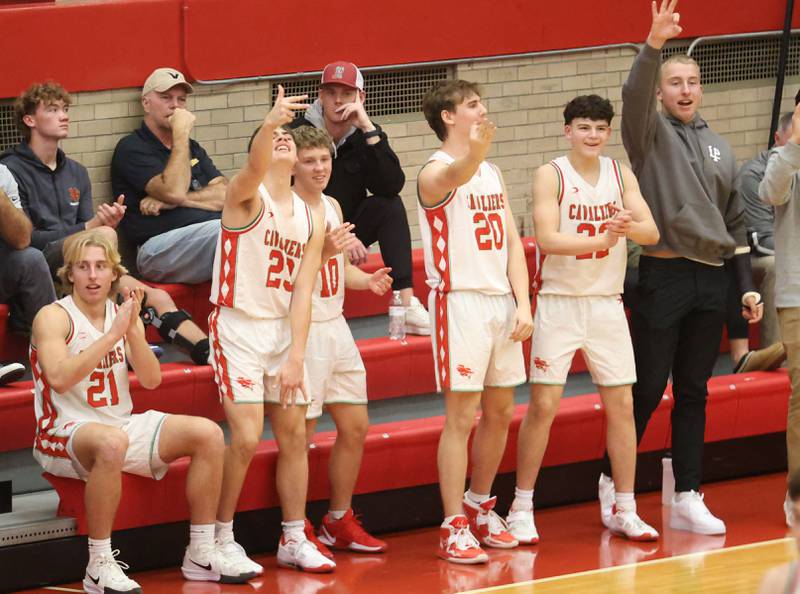 Members of the L-P boys basketball team react after scoring a basket against Streator during the Dean Riley Shootin' The Rock Thanksgiving Tournament on Monday Nov. 24, 2025 in Kingman Gymnasium at Ottawa High School.