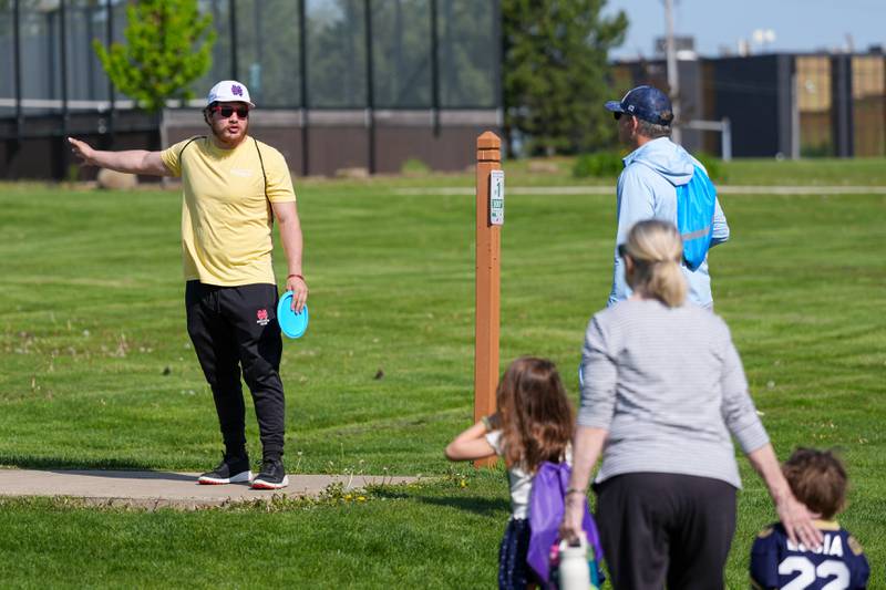 Park District staff explain rules of the disc golf to players at the Glen Ellyn Park District Ace Race disc golf event at Maryknoll Park in Glen Ellyn, IL on Saturday May 10th, 2025.  The Ace Race is just one of many events the Glen Ellyn Park District holds throughout the year.