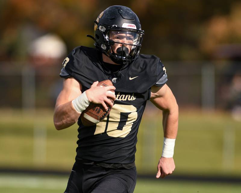 Sycamore's Burke Gautcher (10) runs the ball during the class 5A playoff game on Saturday Nov. 2, 2024, while taking on Chicago Bulls College Prep.