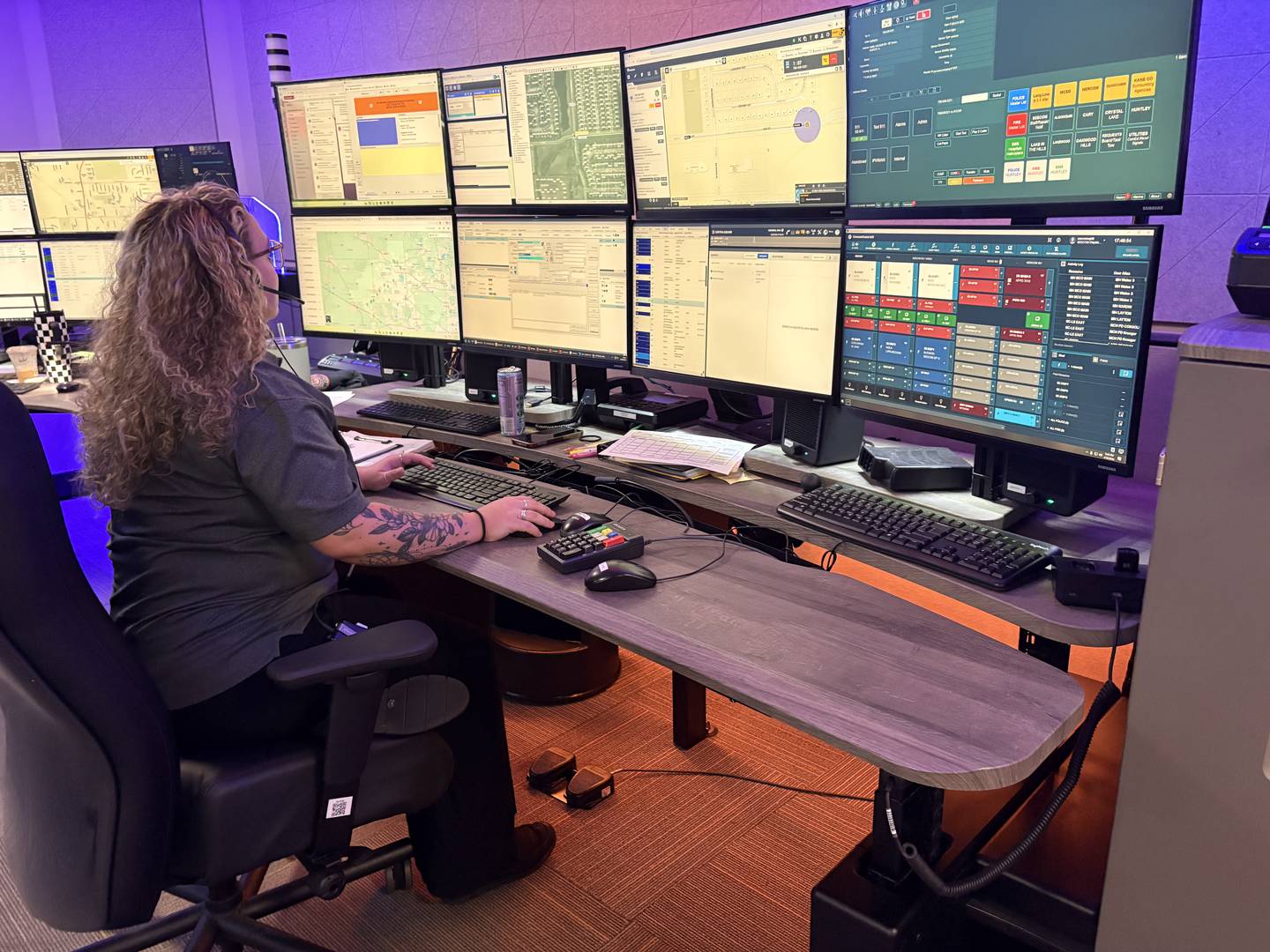 SEECOM dispatcher Mya Warner takes a call in the dispatch center in Crystal Lake, Monday, April 20, 2026.