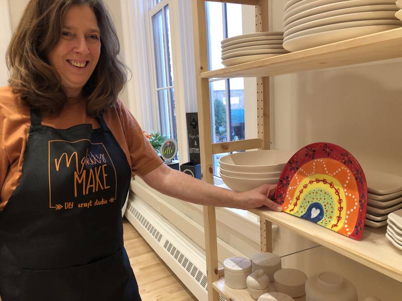 Julie Callahan shares a sample project at Makity Make in Woodstock. The DIY craft shop recently opened its second location in the Old Courthouse.