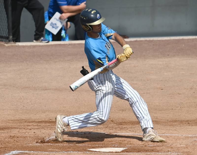 Marquette's Julian Alexander swings at a pitch Monday during the supersectional game against Newman.