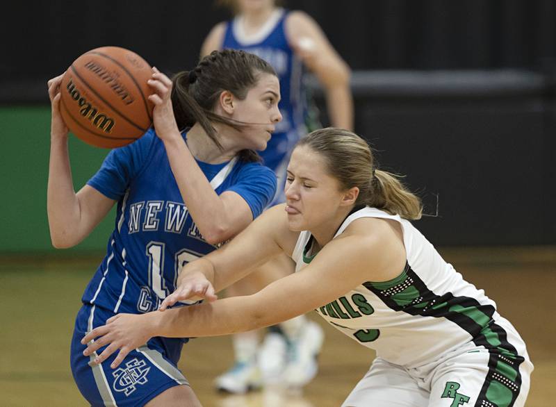 Newman’s Helen Papoccia works against Rock Falls’ Jacee Sigel Thursday, Nov.17, 2022.
