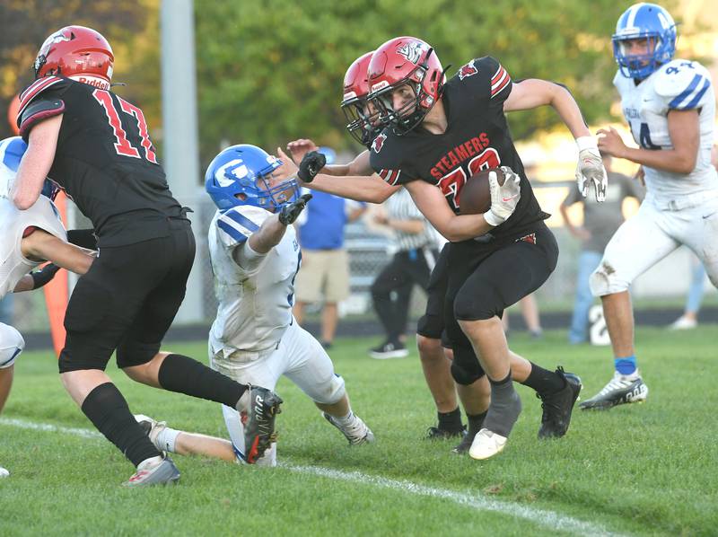 Fulton's Lukas Schroeder fights through the Galena line en route to the endzone during Friday, Aug. 26 action in Fulton.