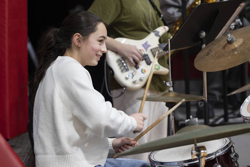 A young musician keeps the beat Tuesday, Feb. 3, 2026, with her Amboy Junior High School band.