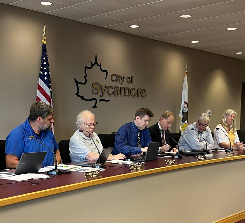 Second Ward Aldermen Pete Paulsen looks at fellow 2nd Ward Alderman Chuck Stowe, as City Manager Michael Hall, city attorney Kevin Buick, Mayor Steve Braser and City Clerk Mary Kalk look at documents during a Sycamore City Council meeting on May 6, 2024.