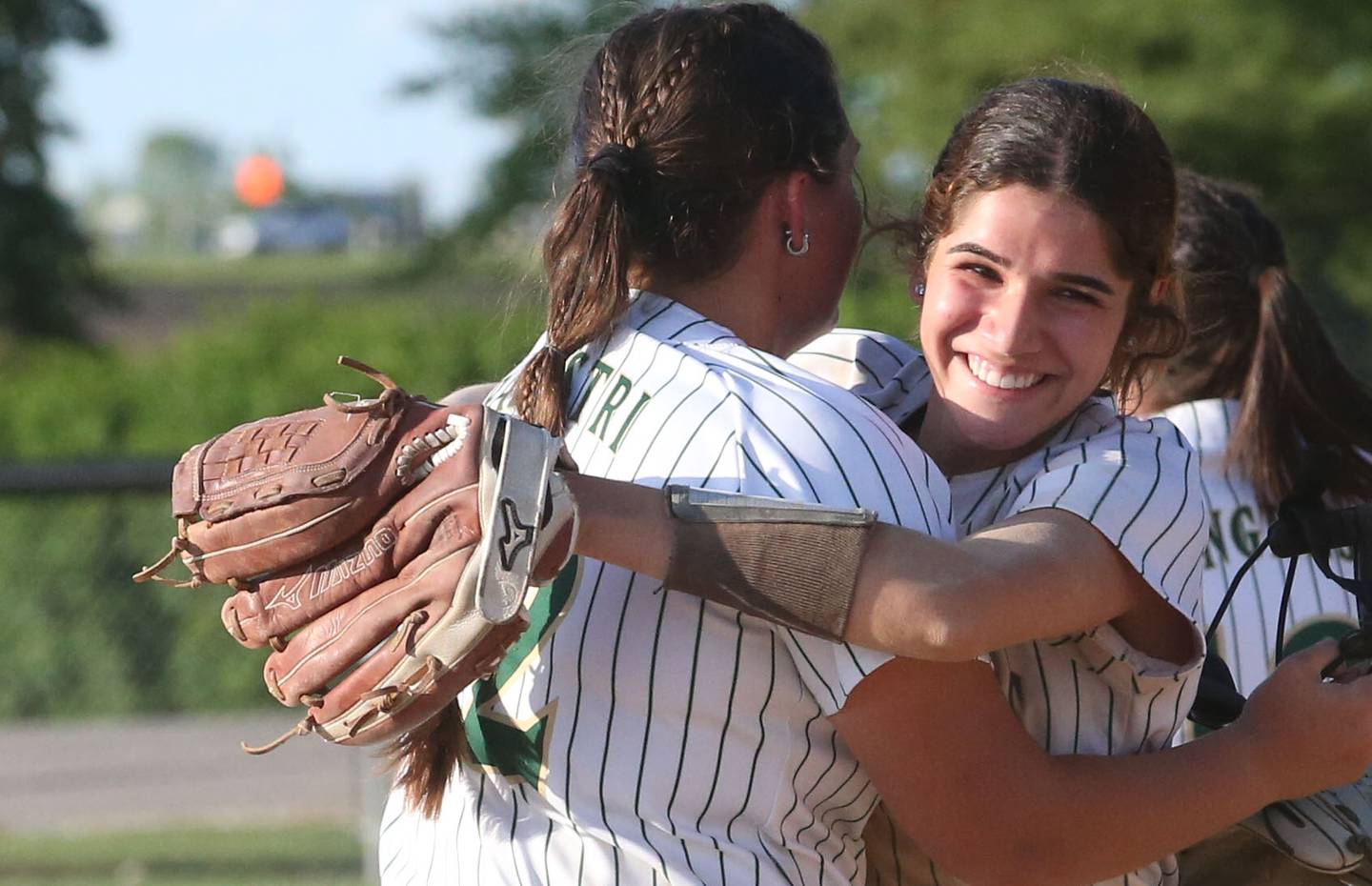 St. Bede's Lily Bosnich hugs teammate Ava Balestri after defeating Illinois Valley Central during the Class 2A Regional final on Friday, May 23, 2025 at St. Bede Academy.