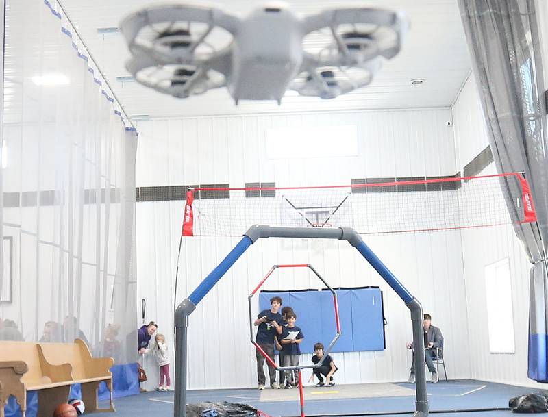 (From left) Noah, William, Elijah, and Samuel Gross of Peru, help fly their drone through obstacles during a drone competition on Saturday, Nov. 22, 2025 at the Second Story Teen Center in Princeton. Teams from Bureau, La Salle and Marshall-Putnam counties came together to showcase their flying skills during the event. Second Story Teen Center partnered with the University of Illinois Extension of Bureau, La Salle Marshall and Putnam Counties. Drones and awards were purchased through a grant and donations from Compeer Financial.
