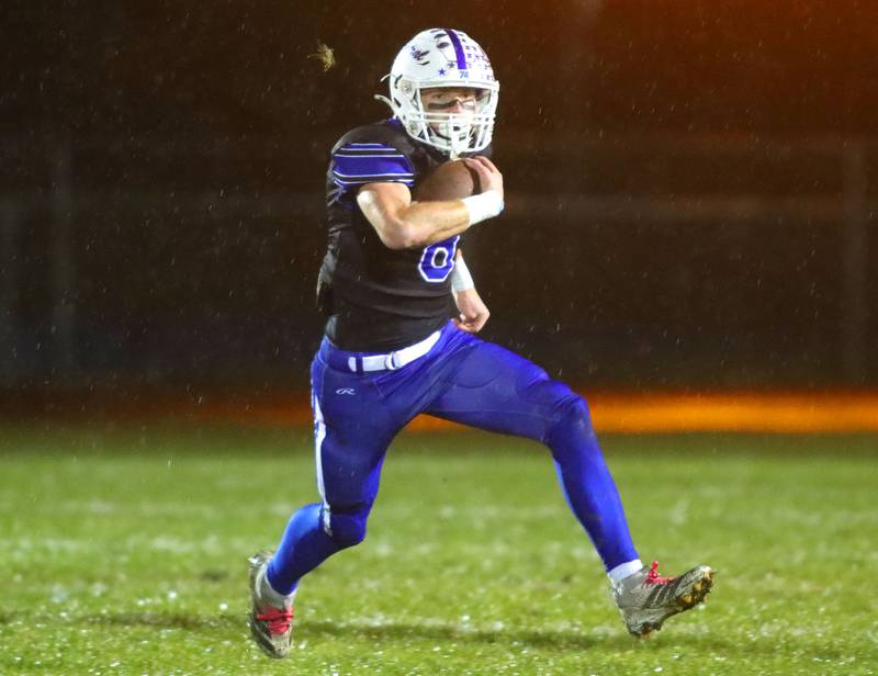 Burlington Central’s Tyler McGladdery moves with the ball against Harlem in IHSA football Class 6A second-round playoff action at Central High School in Burlington on Saturday, November 8, 2025.