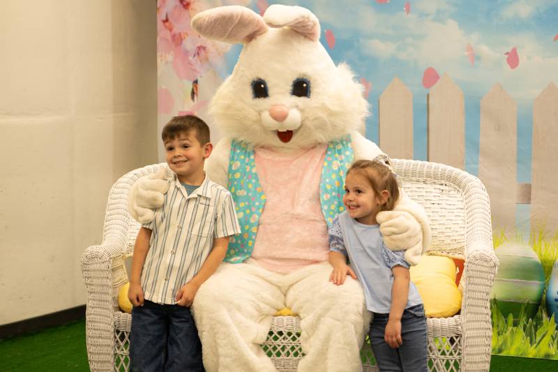 Hudson Shevlin (left) and Madison Shevlin (right) take photo with Easter bunny at the annual Easter Egg hunt on Saturday, April 12, 2025 at Hall High School in Spring Valley.