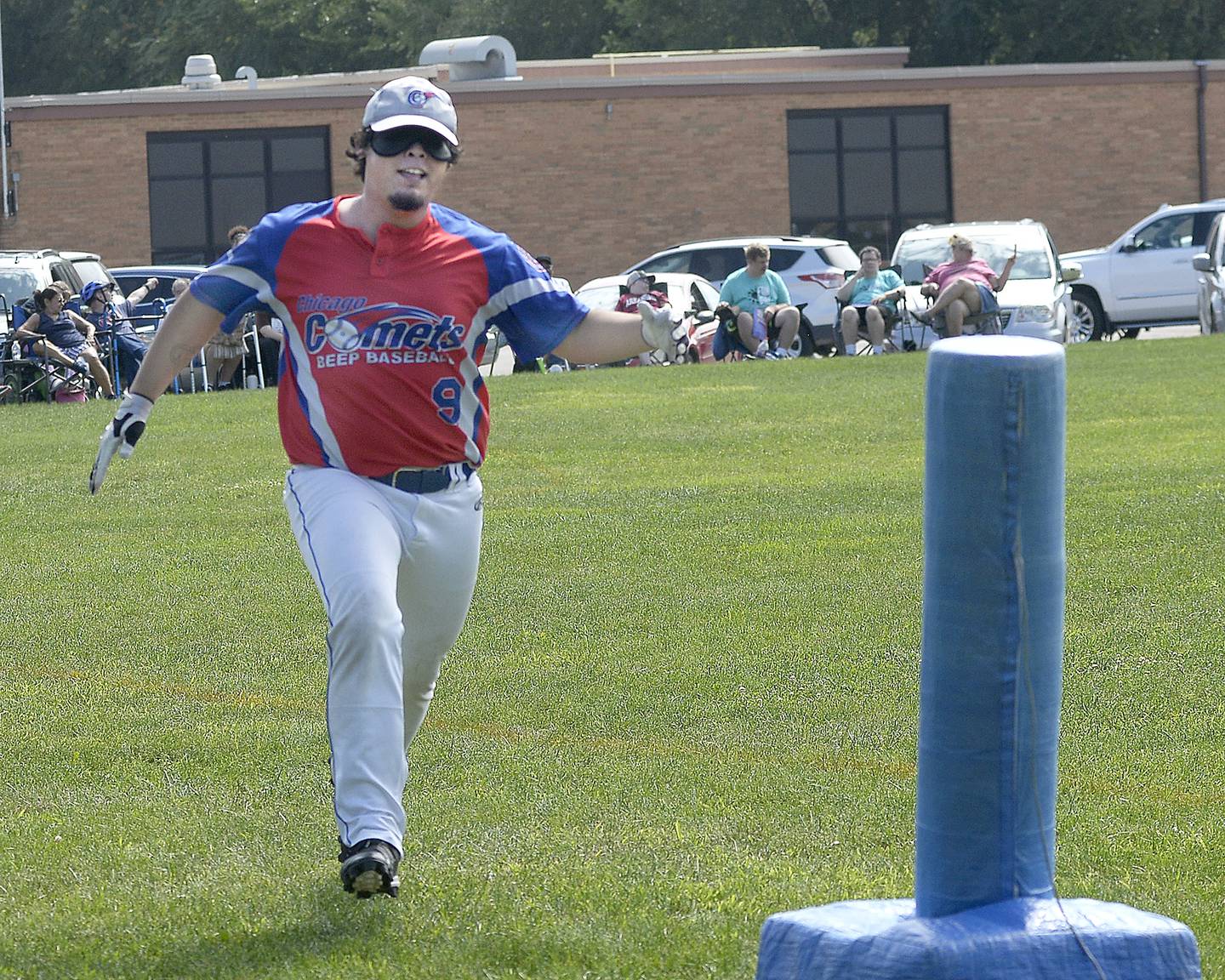 Gerardo Tavera of The Chicago Comets begins to reach for the first base bag he hears during a beep baseball game Saturday, Aug. 19, 2023, against the Hardscrabble Lions volunteers at Northlawn School in Streator. The Chicago Comets were the 2003 Beep Baseball World Champions.