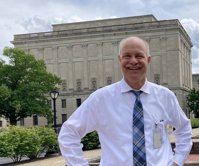 Retired Illinois State Archivist Dave Joens stands in front of the Margaret Cross Norton Building in Springfield.