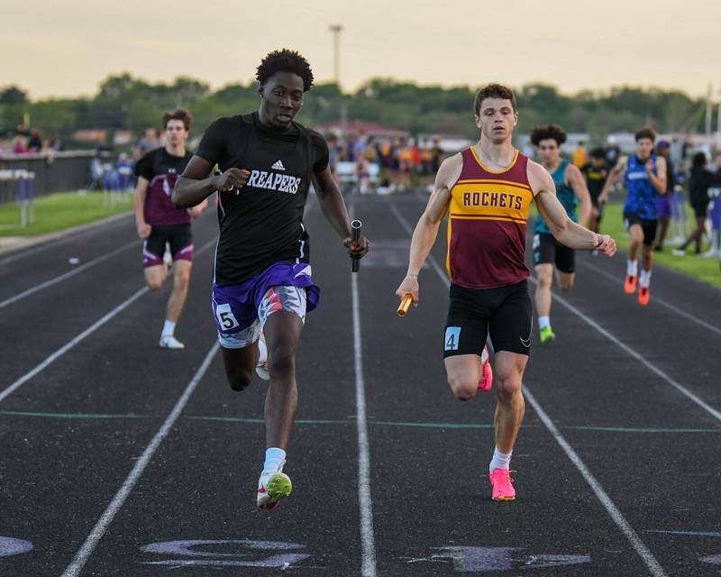 Christ Keleba of Plano, left, beats out Richmond-Burton runner Max Loveall at the finish line of the 200 meter relay during the Kishwaukee River Conference track meet on Tuesday May 7, 2024, held at Plano High School.