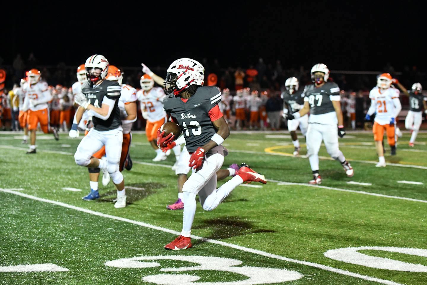 Bradley-Bourbonnais' Lyzale Edmon returns an interception for a touchdown Friday, Nov. 8. 2024, during the Boilermakers' 42-0 victory over Whitney Young in the second round of the IHSA Class 7A Playoffs at Bradley-Bourbonnais.