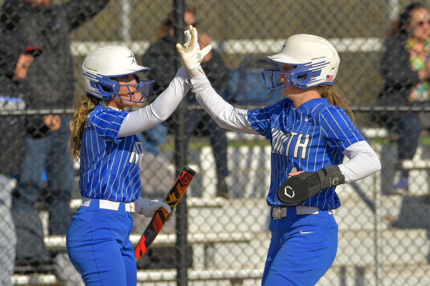 St. Charles North's Maddie Hernandez (2) congratulates Julia Larson (4) on scoring against Lake Park during a game on Friday, April 21, 2023.