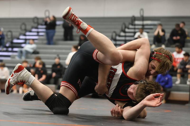 Minooka’s Maddux Tindal drops Yorkville’s Nathan Craft in the SouthWest Prairie Conference 132 pound championship on Saturday, Jan. 24, 2026 in Minooka.