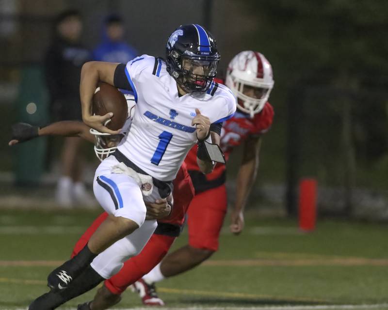 St. Francis's Brock Phillip (1) takes off downfield during football game between St. Francis at Kenwood Academy on Thursday, Aug 28, 2025  in Chicago.