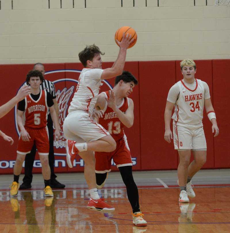 Oregon's Cooper Johnson (3) and Morrison's Jeramiah Callan (13) collide as Johnson goes after a pass on Saturday, Jan. 11, 2025 at the Blackhawk Center in Oregon.