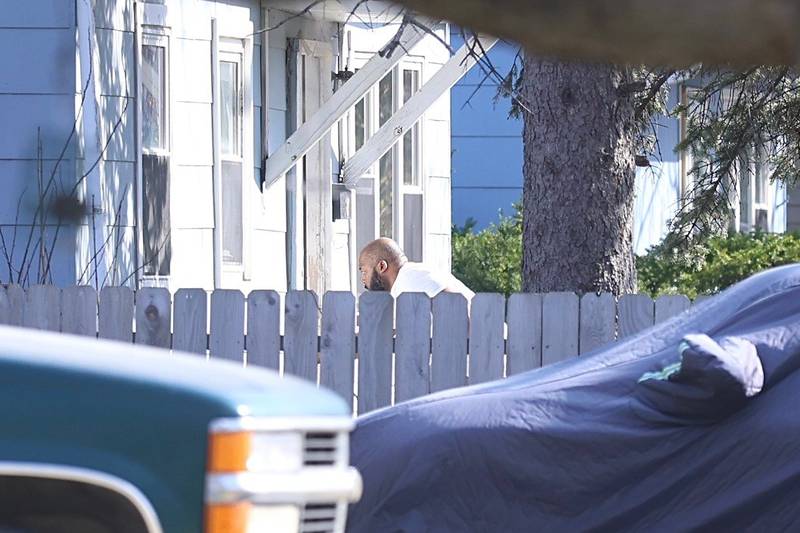 A person seen outside of the Joliet home where someone barricaded themselves inside on Monday, March 30, 2026. Will County sheriff's police and Joliet police officers had the area around McDonnaugh Street and Hammes Avenue blocked off.
