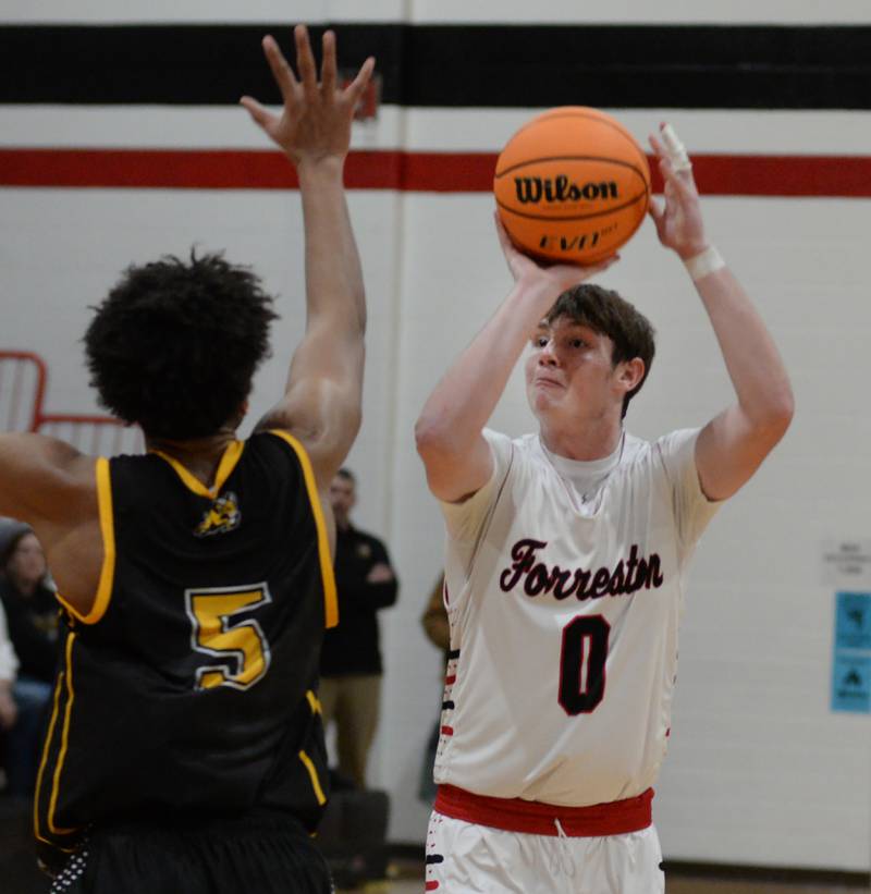 Forreston's Brandon Greenfield (0) shoots against Riverdale on Friday, Dec. 27, 2024 at the Cliff Warkins Memorial Basketball Tournament at Erie High School.