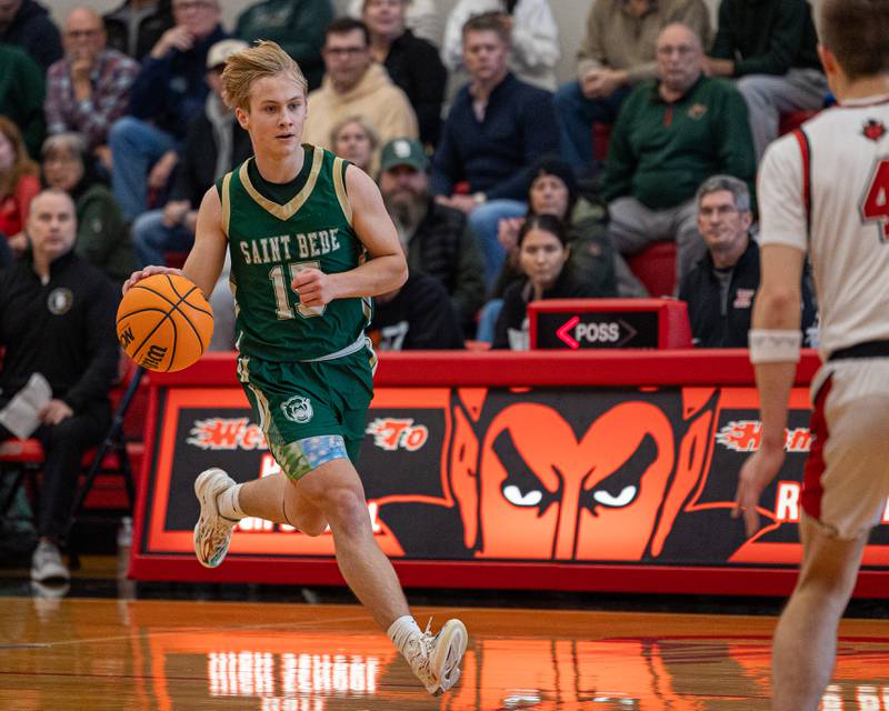 St. Bede's Geno Dinges (15) dribbles ball down court on Saturday, January 31, 2026 at Hall High School in Spring Valley.