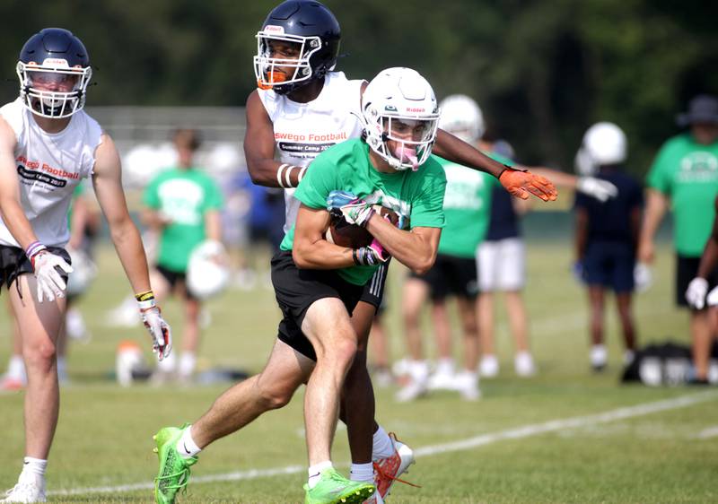 York’s Luke Mailander makes a catch during a 7-on-7 football tournament at West Aurora High School on Friday, June 23, 2023.