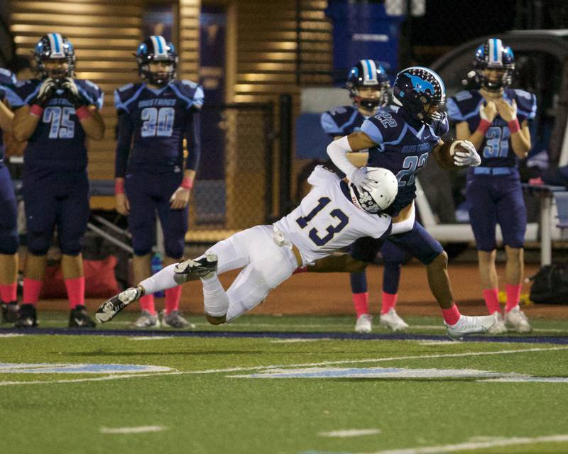 Downers Grove South's Keon Maggit is pushed out of bounds by Addison Trails Jj Ciezobka on Friday, Oct.20,2023 in Downers Grove.