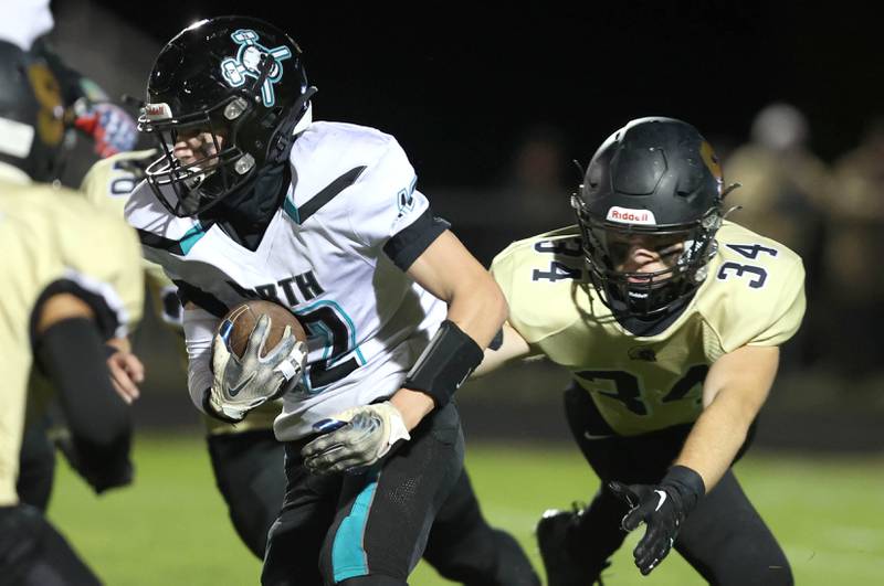 Woodstock North's Landan Creighton tries to get ahead of Sycamore's Joey Puleo during their game Friday Oct. 7, 2022, at Sycamore High School.