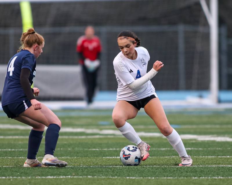 Riverside-Brookfield's Michelle Panduro (4) makes a move with the ball during soccer match between Riverside-Brookfield at Downers Grove South.  April 10, 2025.