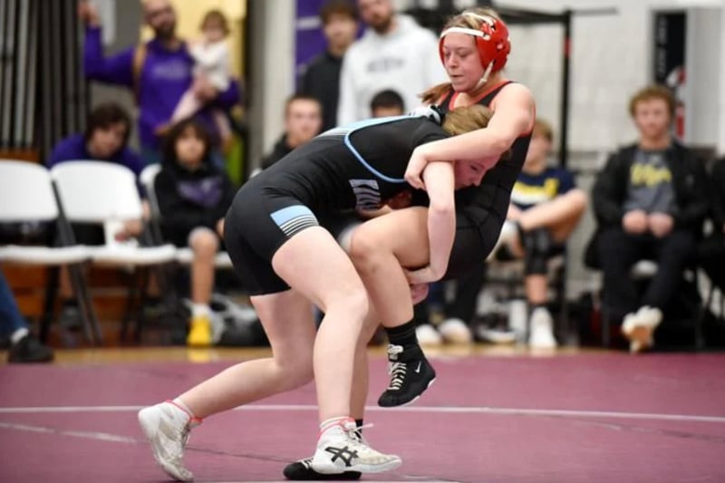 Kankakee's Isabella Kirkpatrick, left, scores a takedown on Bradley-Bourbonnais' Alyssa Larios during Wednesday's All-City meet at Kankakee.
