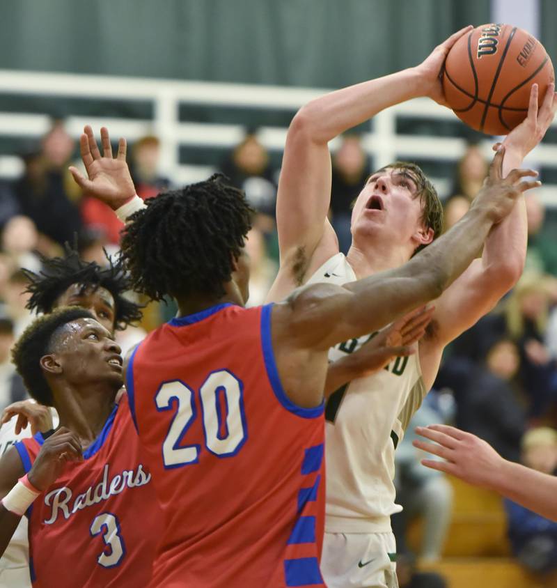 John Starks/jstarks@dailyherald.com
Glenbard West’s Logan Brown tries to get a clean shot against Glenbard South’s Cam Williams and D'Manuel Payton, left, in a boys basketball game in Glen Ellyn on Monday, November 21, 2022.