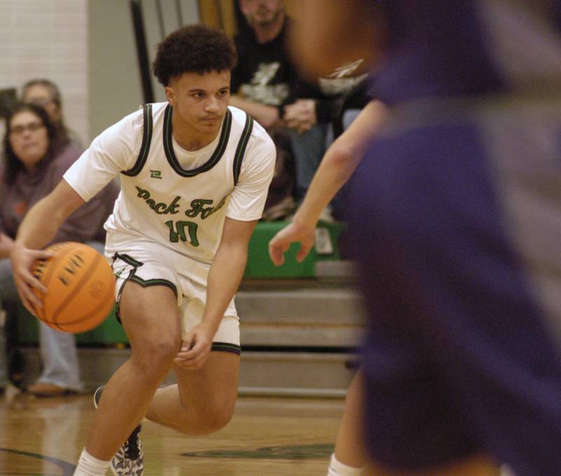 Rock Falls player Z'Viyon Martin brings the ball up court. The Rock Falls Rockets hosted the Dixon Dukes in a Conference basketball game. The game was held at Forest Tabor gym in Rock Falls on Friday, February 13, 2026