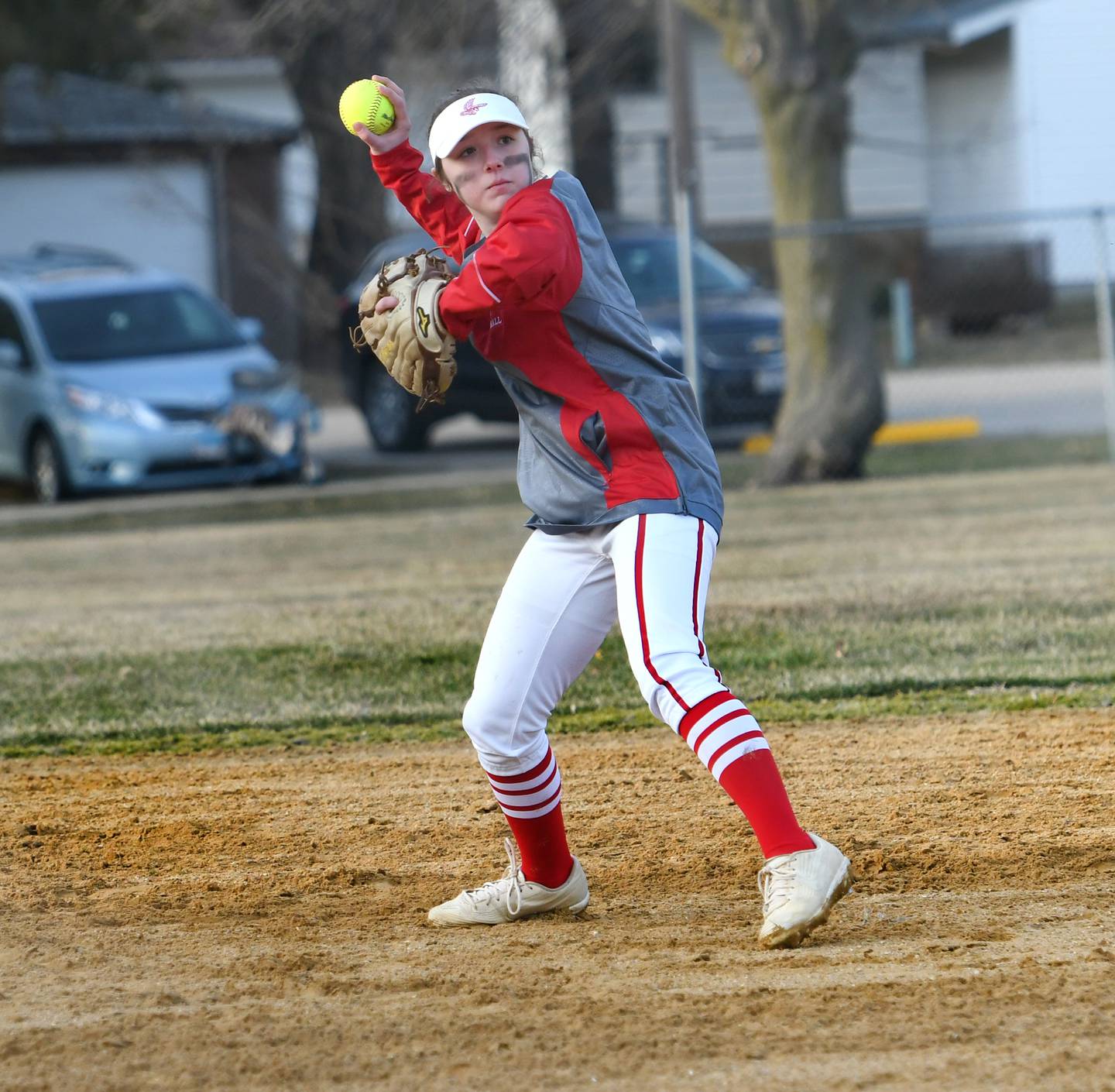 Oregon shortsop Reilee Suter zeroes in on first base to throw out a Milledgeville player during Monday, March 20 action at Dillehay Park in Mt. Morris, The game was moved from Oregon to Mt. Morris due to wet field conditions at Oregon Park West.