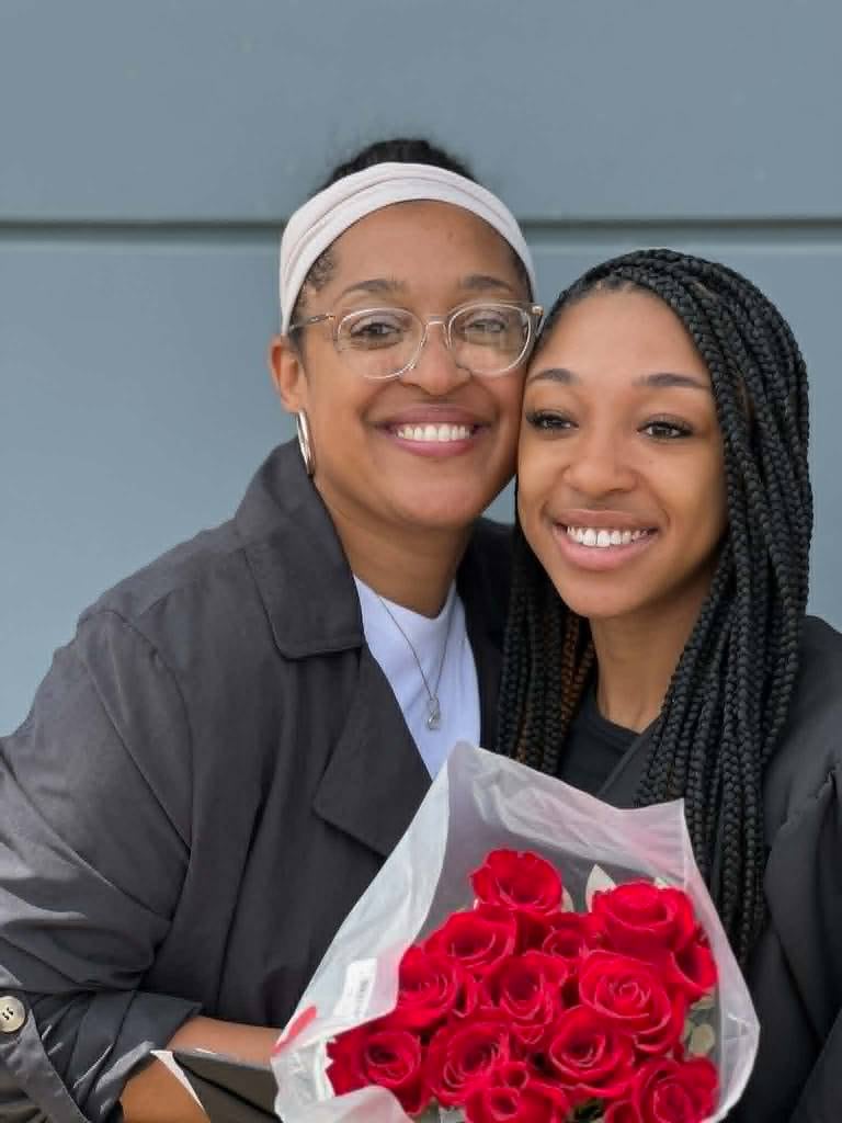 Sariyah Watson (right) holds a bouquet of roses next to her mother, Surray Williams (left) on her graduation day from DeKalb High School in 2023. Watson, now 21, a UIC track and field sprinter, was killed in a wrong-way crash on Interstate 88 on Sunday, May 10, 2026.