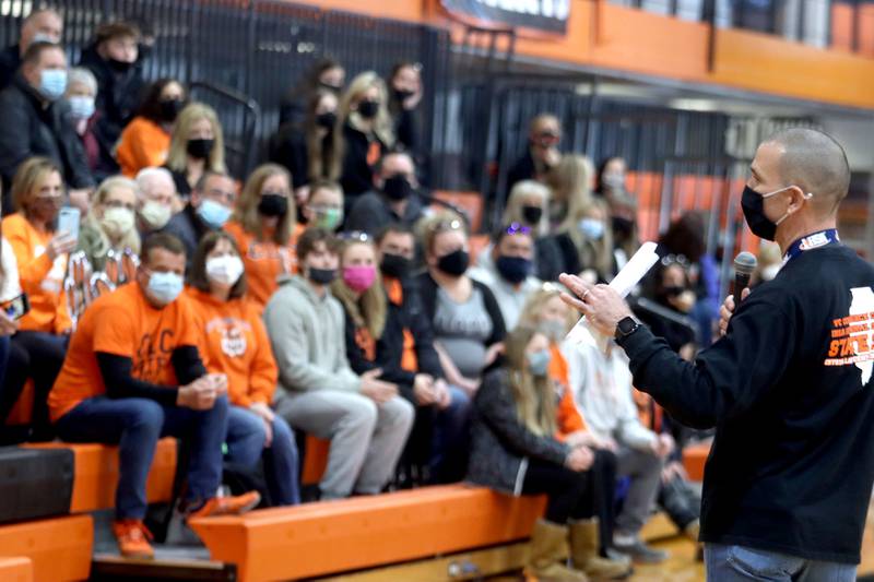 Athletic Director Jeff Aldridge speaks as Crystal Lake Central held a celebration Sunday in their gymnasium after the Tigers on Saturday won the IHSA state title in Competitive Cheerleading-Medium Team at Grossinger Motors Arena in Bloomington.