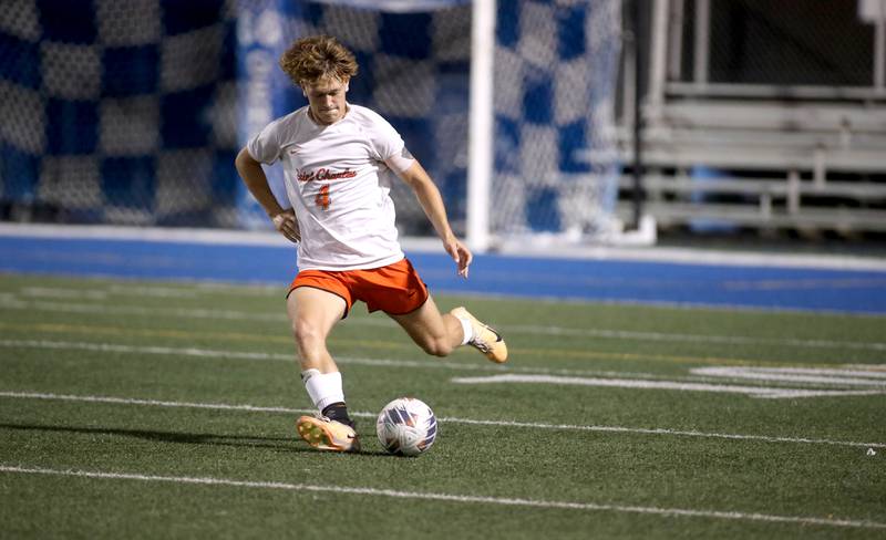 St. Charles East’s Griffin Counts kicks the ball during a game at Geneva on Tuesday, Oct. 3, 2023.